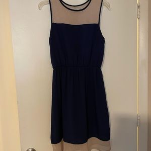 Super cute skater dress. Navy blue with tan trim